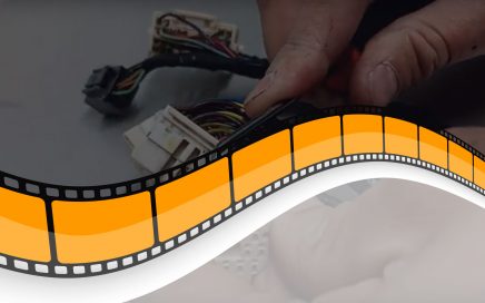 Hands Working on Wiring Harness with Film Strip Icon